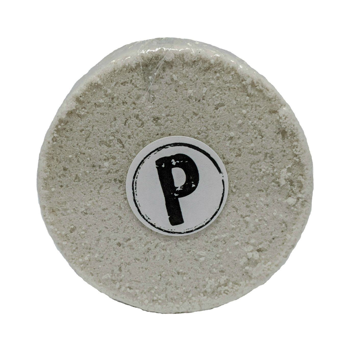 A round white bath bomb stamped with the shop's circled P mark