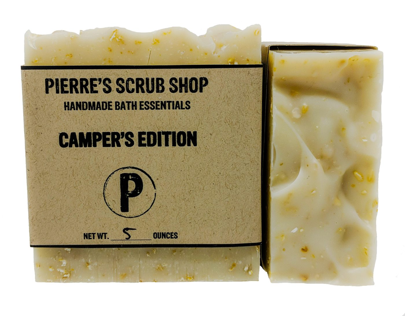 A Camper's Edition bar in its kraft paper wrapper beside an unwrapped cream and speckled bar