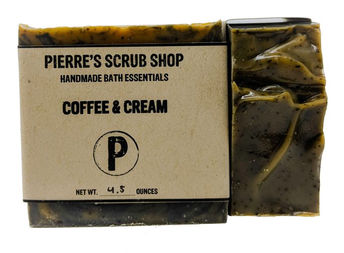 A Coffee & Cream bar in its kraft paper wrapper beside an unwrapped dark brown bar
