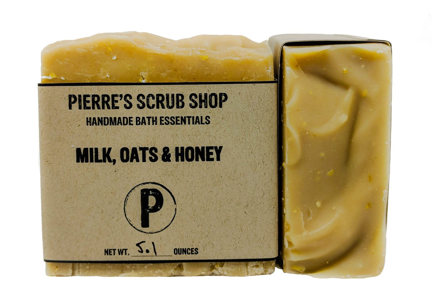 A Milk, Oats & Honey bar in its kraft paper wrapper beside an unwrapped golden bar