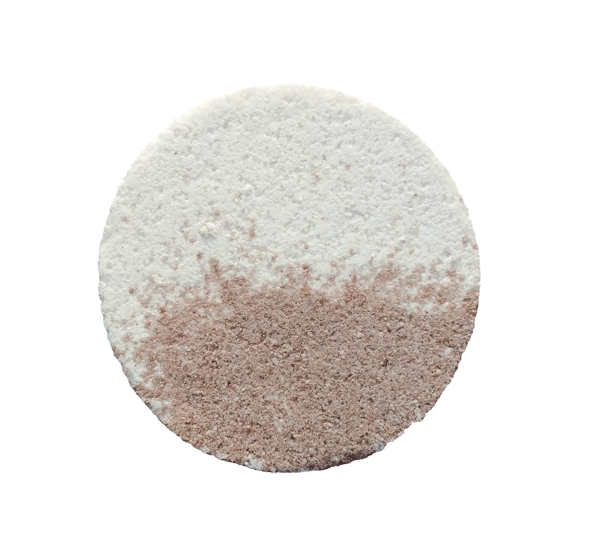 A round bath bomb with a white half and a dusty pink half