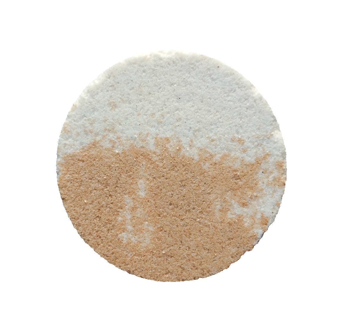 A round bath bomb with a white half and a tan half
